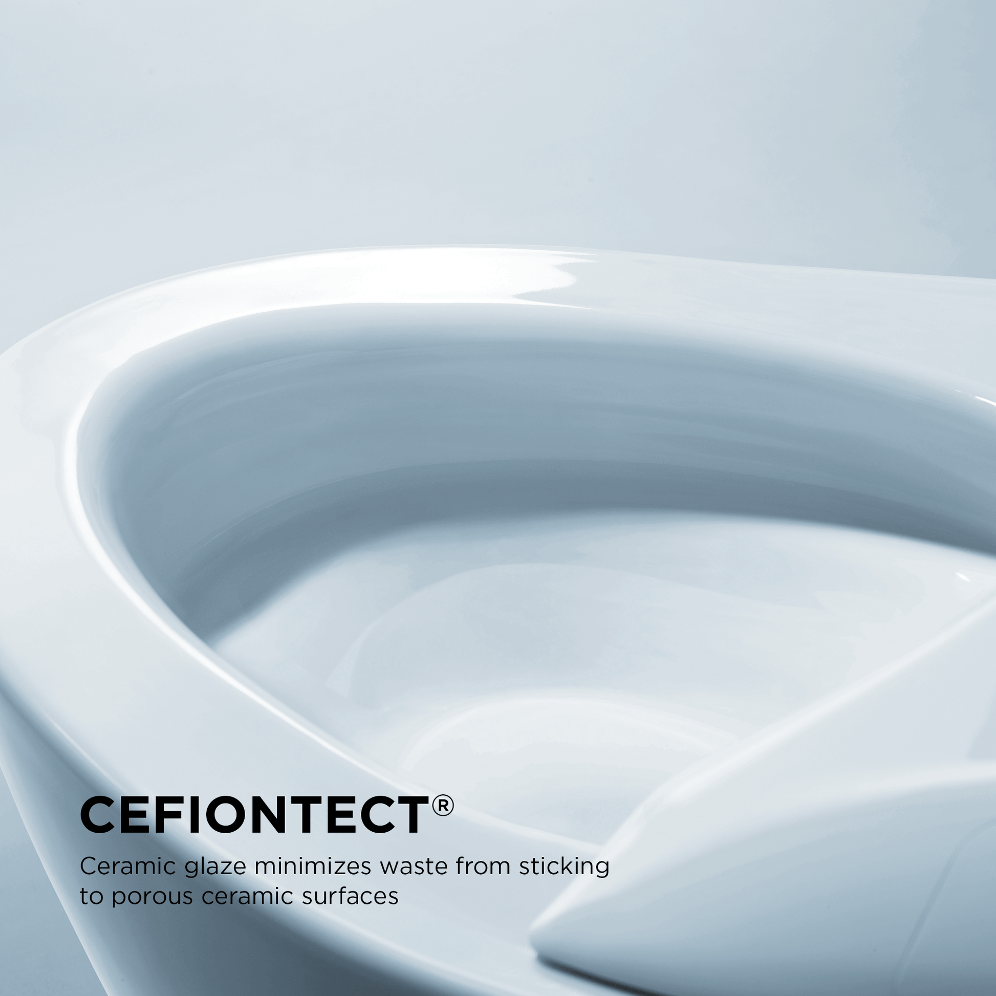 Close-up of TOTO Neorest RH toilet bowl with CEFIONTECT glaze for efficient waste reduction on ceramic surfaces.